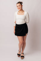 Bentli High Rise Side Tie Denim Skort in Black - Charming Charlie