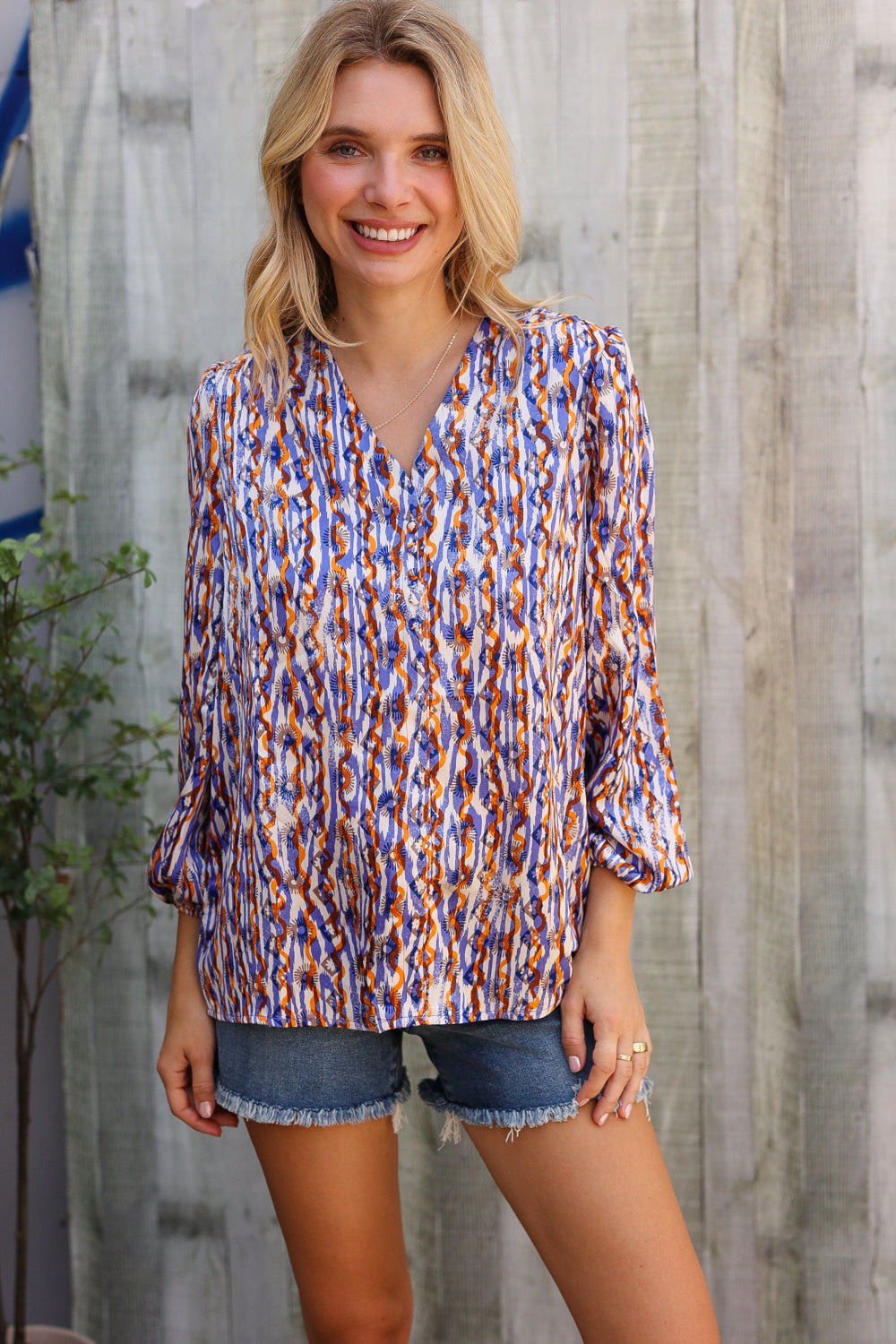 On A Wild Streak V Neck Fabric Button Detail Blouse - Charming Charlie