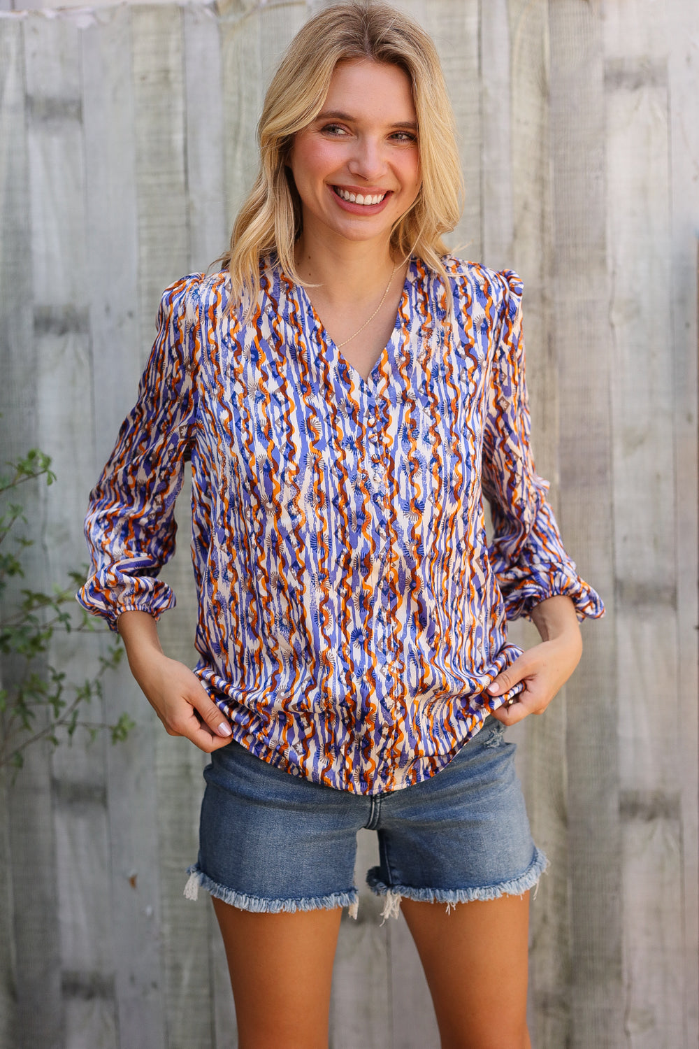 On A Wild Streak V Neck Fabric Button Detail Blouse - Charming Charlie