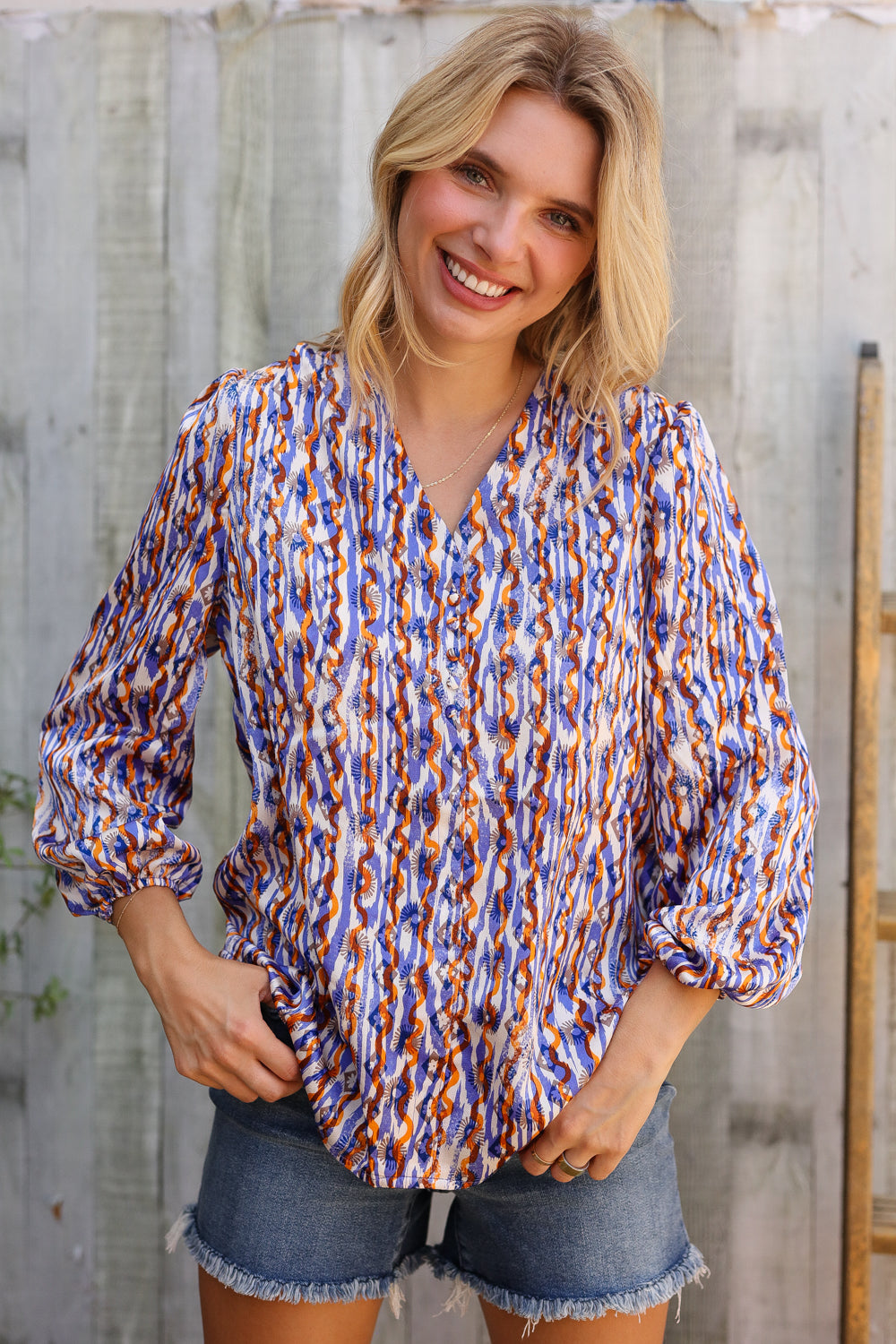 On A Wild Streak V Neck Fabric Button Detail Blouse - Charming Charlie