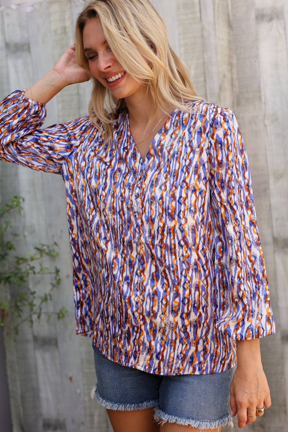 On A Wild Streak V Neck Fabric Button Detail Blouse - Charming Charlie