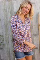 On A Wild Streak V Neck Fabric Button Detail Blouse - Charming Charlie