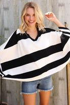 The Traveler Black/White Stripe Dolman Notch Neck Sweater Poncho - Charming Charlie