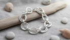 Silver Link Bracelet Featuring Interlocking Circles - Charming Charlie