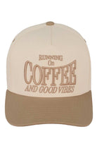 Beige C.C RUNNING ON COFFEE AND GOOD VIBES Trucker Cap is the perfect accessory for any coffee lover. Made from high-quality materials, this cap will keep you stylish and comfortable while you enjoy your favourite caffeinated beverage. With its trendy design and positive message, it's sure to bring good vibes wherever you go.