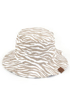 Beige C.C. ZEBRA PRINT BUCKET HAT is the perfect accessory for any outdoor adventure. Made from high-quality materials, it offers both style and functionality. Stay protected from the sun and make a statement with its bold zebra print design. Trust in C.C. for expertly crafted hats.