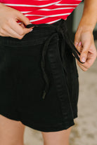 Bentli High Rise Side Tie Denim Skort in Black - Charming Charlie