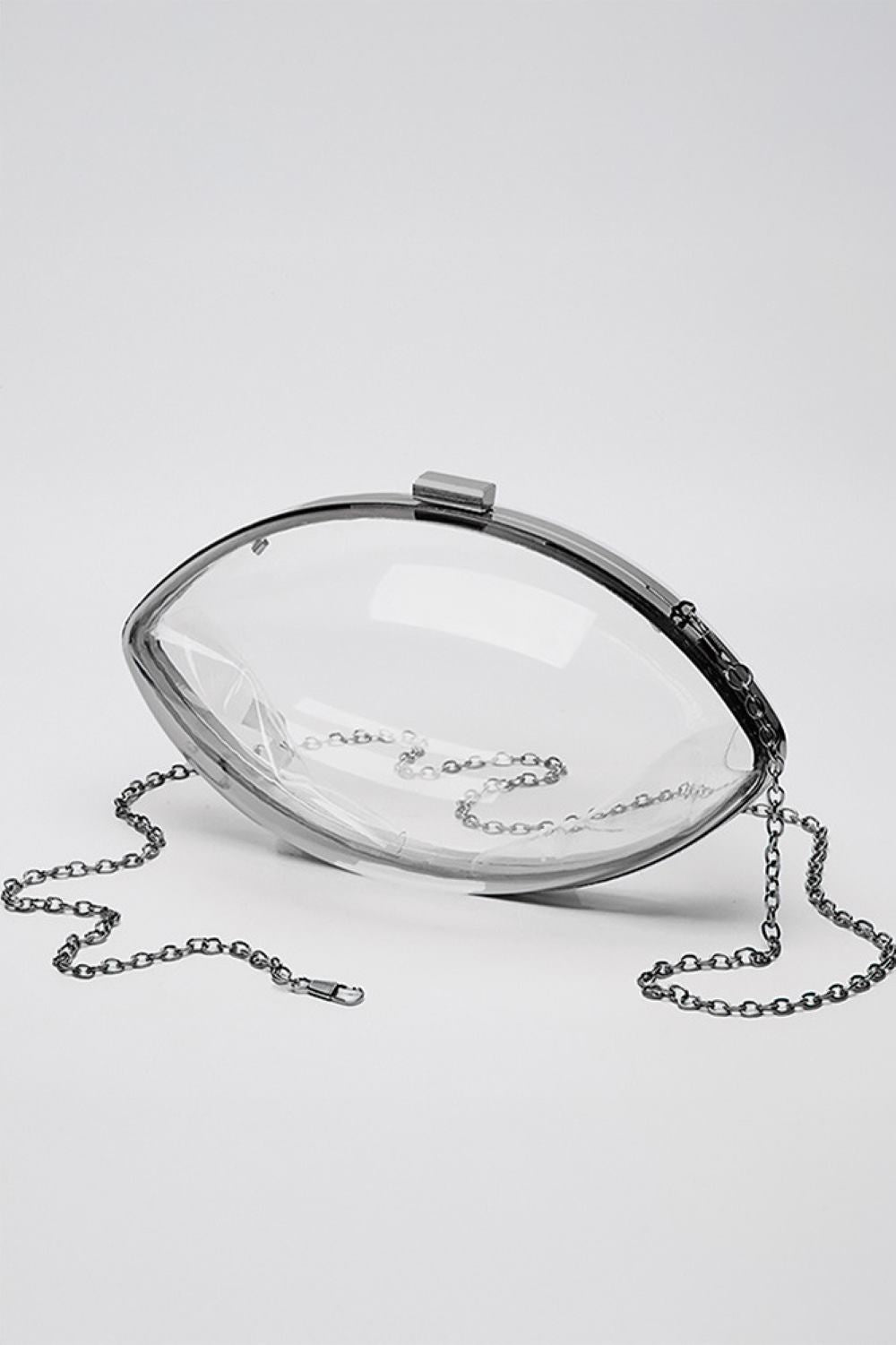 Black Clear Acrylic Football Stadium Clutch Bag is expertly crafted from high-quality transparent acrylic, ensuring compliance with stadium security policies while offering a sleek, modern aesthetic. Its rigid structure protects your essentials, and the compact size provides convenient portability. Perfect for sports events, this clutch combines practicality with style for the discerning fan.