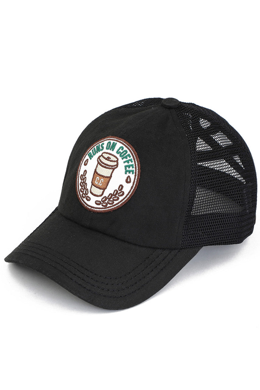 Black C.C RUNS ON COFFEE PATCH CRISS CROSS PONY CAP combines fashion with function, featuring a unique criss-cross design and a playful "Runs on Coffee" patch. Made with high-quality materials, this cap is perfect for those who want to show off their love for coffee while staying stylish and comfortable.
