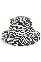 Black C.C. ZEBRA PRINT BUCKET HAT is the perfect accessory for any outdoor adventure. Made from high-quality materials, it offers both style and functionality. Stay protected from the sun and make a statement with its bold zebra print design. Trust in C.C. for expertly crafted hats.