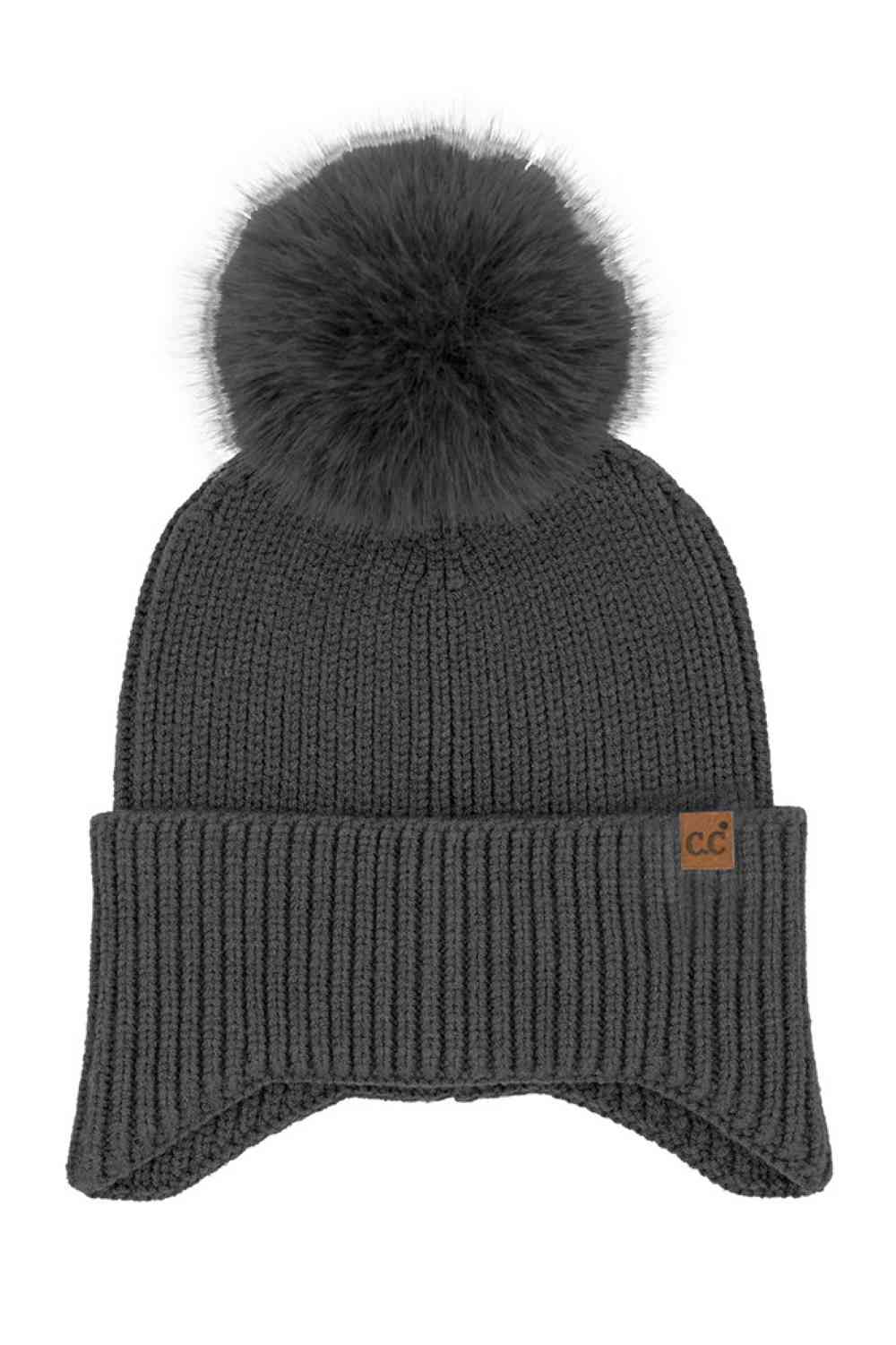Black Stay cozy and chic with our C.C Earflap Pom Knit Solid Beanie! This adorable beanie features ear flaps and a playful pom-pom, adding a touch of fun to your winter wardrobe. Whether you're hitting the slopes or strolling in the city, this beanie is a must-have accessory. Perfect for gifting or treating yourself—elevate your look with this stylish beanie today!
