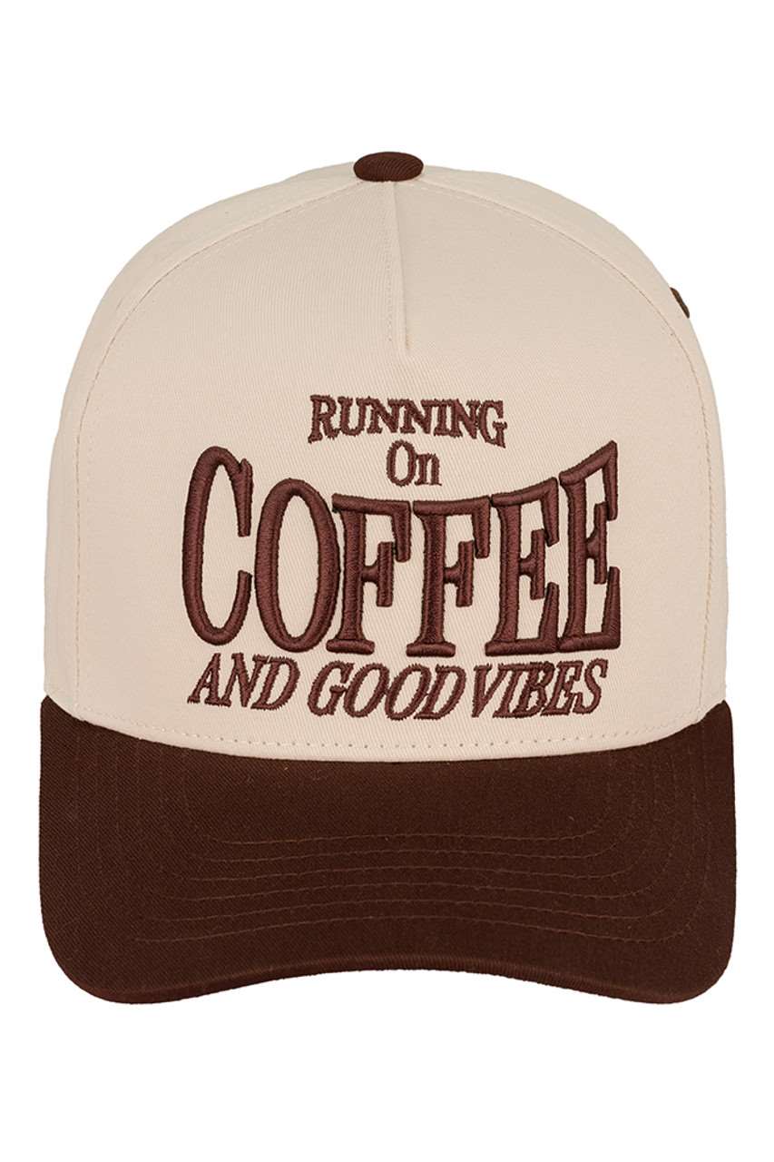 Brown C.C RUNNING ON COFFEE AND GOOD VIBES Trucker Cap is the perfect accessory for any coffee lover. Made from high-quality materials, this cap will keep you stylish and comfortable while you enjoy your favourite caffeinated beverage. With its trendy design and positive message, it's sure to bring good vibes wherever you go.