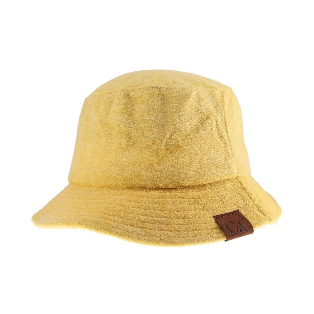 Bumble bee C.C. Terry Cloth Bucket Hat offers both style and functionality. It is made with high-quality terry cloth material, providing a comfortable and breathable fit. Perfect for sunny days, it also offers protection from harmful UV rays. Upgrade your summer wardrobe now.