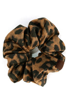 Camel C.C Leopard Velvet Scrunchies are the perfect addition to your hair accessory collection. Made with luxurious velvet material, these scrunchies provide a soft and comfortable hold for all hair types. With their trendy leopard print design, they add a touch of style to any outfit. Upgrade your hair game with these must-have scrunchies!