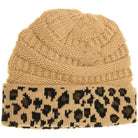 Camel Matching Cuff Leopard Print CC Beanie combines expert craftsmanship with standout style. Designed with a comfortable cuff and eye-catching leopard pattern, this beanie offers reliable warmth and a fashionable look. Its stretchy fabric ensures a secure fit for extended wear, making it an ideal accessory for cool weather while enhancing your seasonal wardrobe with a touch of wild sophistication. 