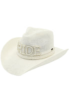 Clear White lC.C. Bride's cowboy hat features a beautiful pearl and rhinestone trim, adding a touch of elegance to a classic design. Perfect for weddings, festivals, and everyday wear, this hat will elevate any outfit and provide added sun protection. A must-have accessory for any fashion-forward cowgirl