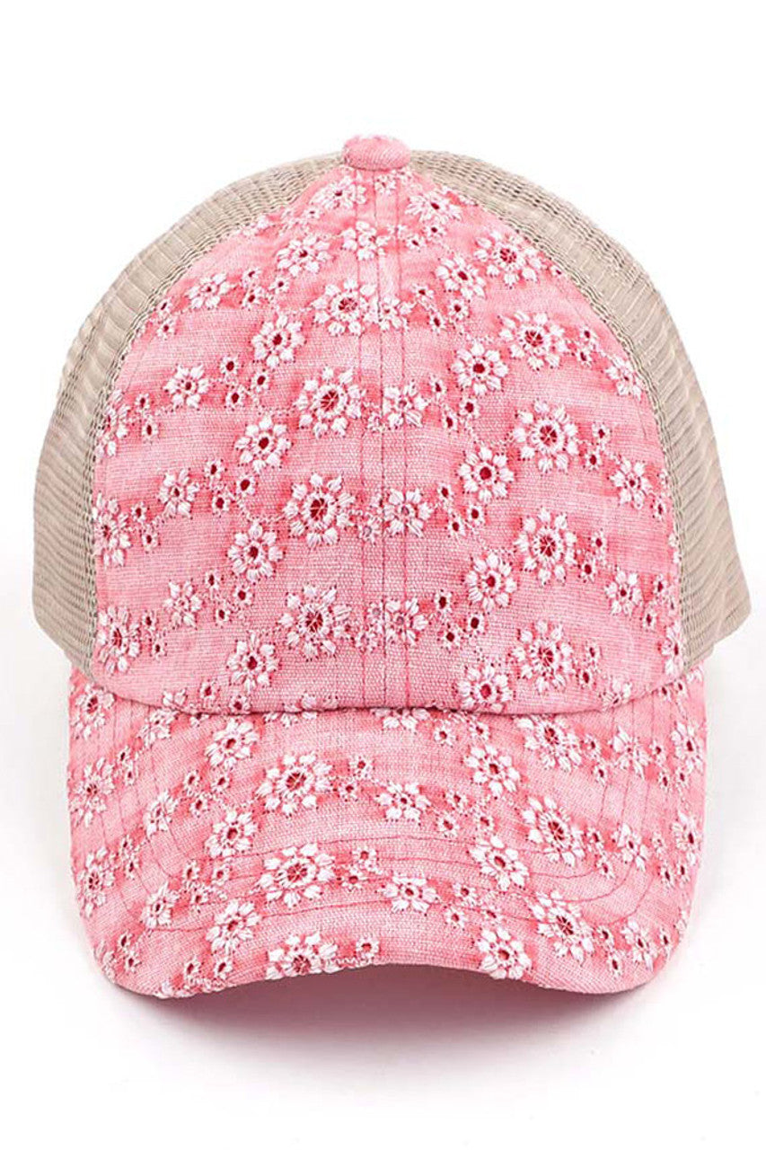 Coral C.C FLOWER EMBROIDERY EYELET CRISS CROSS PONYCAP features delicate flower embroidery and eyelet detailing, with a criss cross design for a chic and stylish look. Made with quality materials, this cap offers both fashion and functionality. Perfect for any casual or outdoor activity, it will keep you cool and covered.