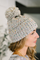 Cover Your Ears Pom Pom Beanie in Grey - Charming Charlie