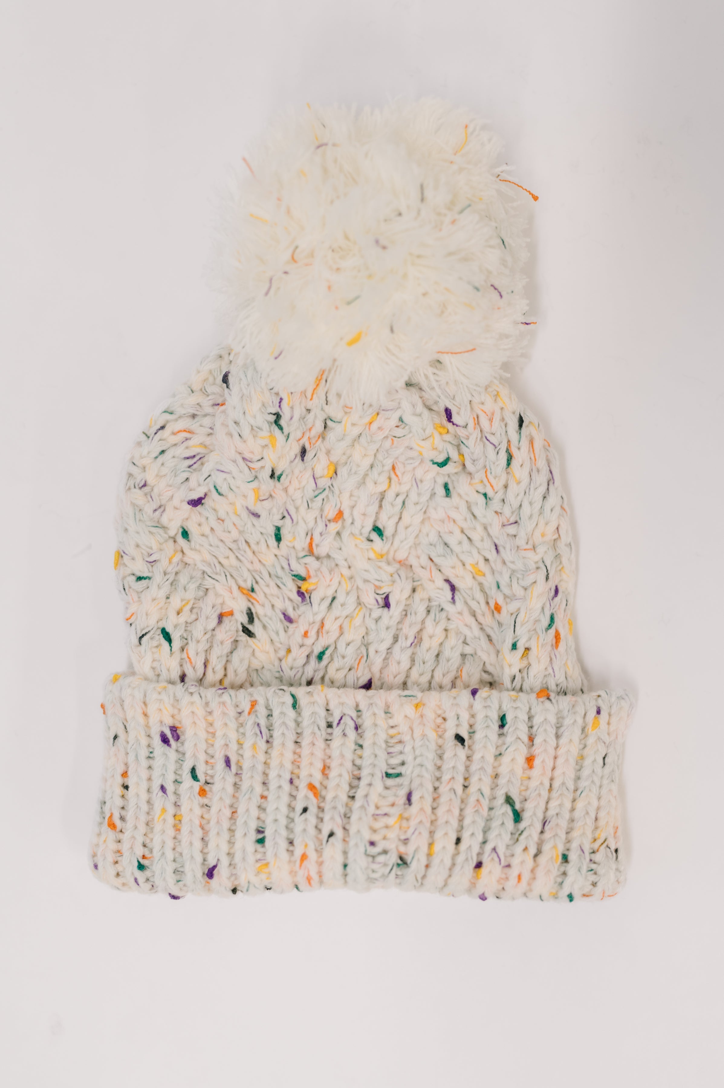 Cover Your Ears Pom Pom Beanie in Ivory - Charming Charlie
