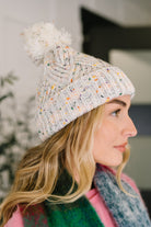 Cover Your Ears Pom Pom Beanie in Ivory - Charming Charlie