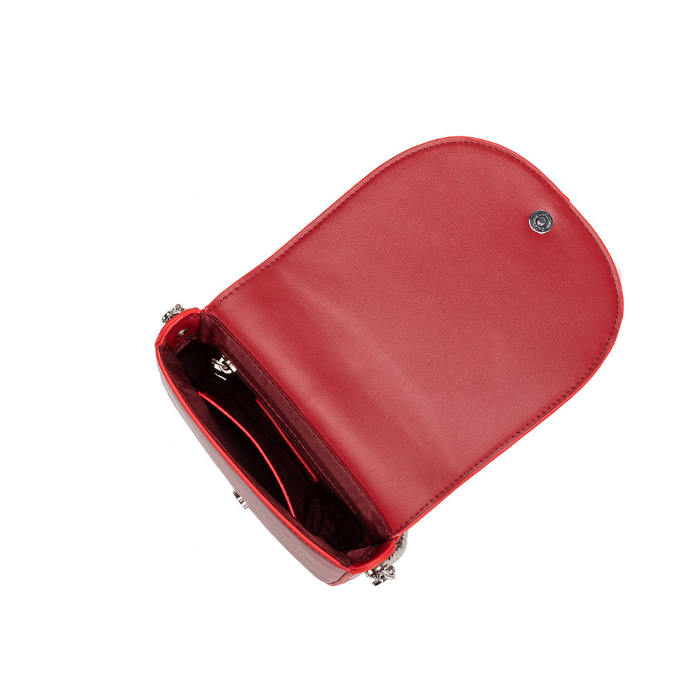 A red vegan leather crossbody handbag with silver handle.