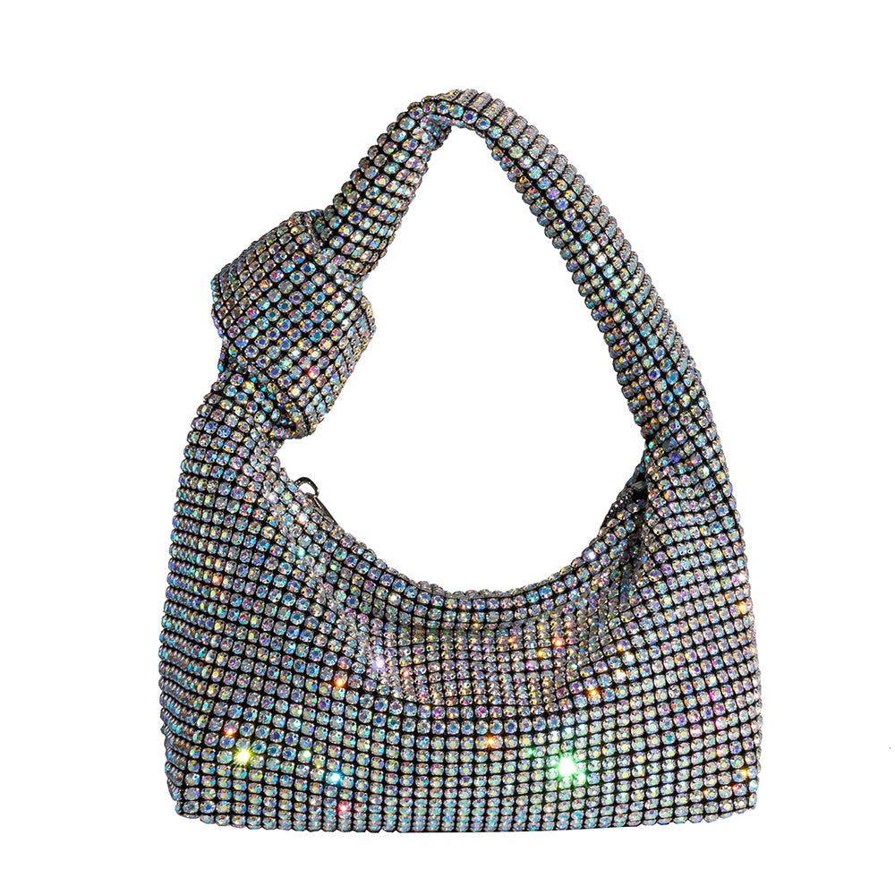 A small multi-colored crystal encrusted top handle bag with a knot.