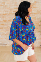Dreamer Peplum Top in Royal and Red Abstract - Charming Charlie