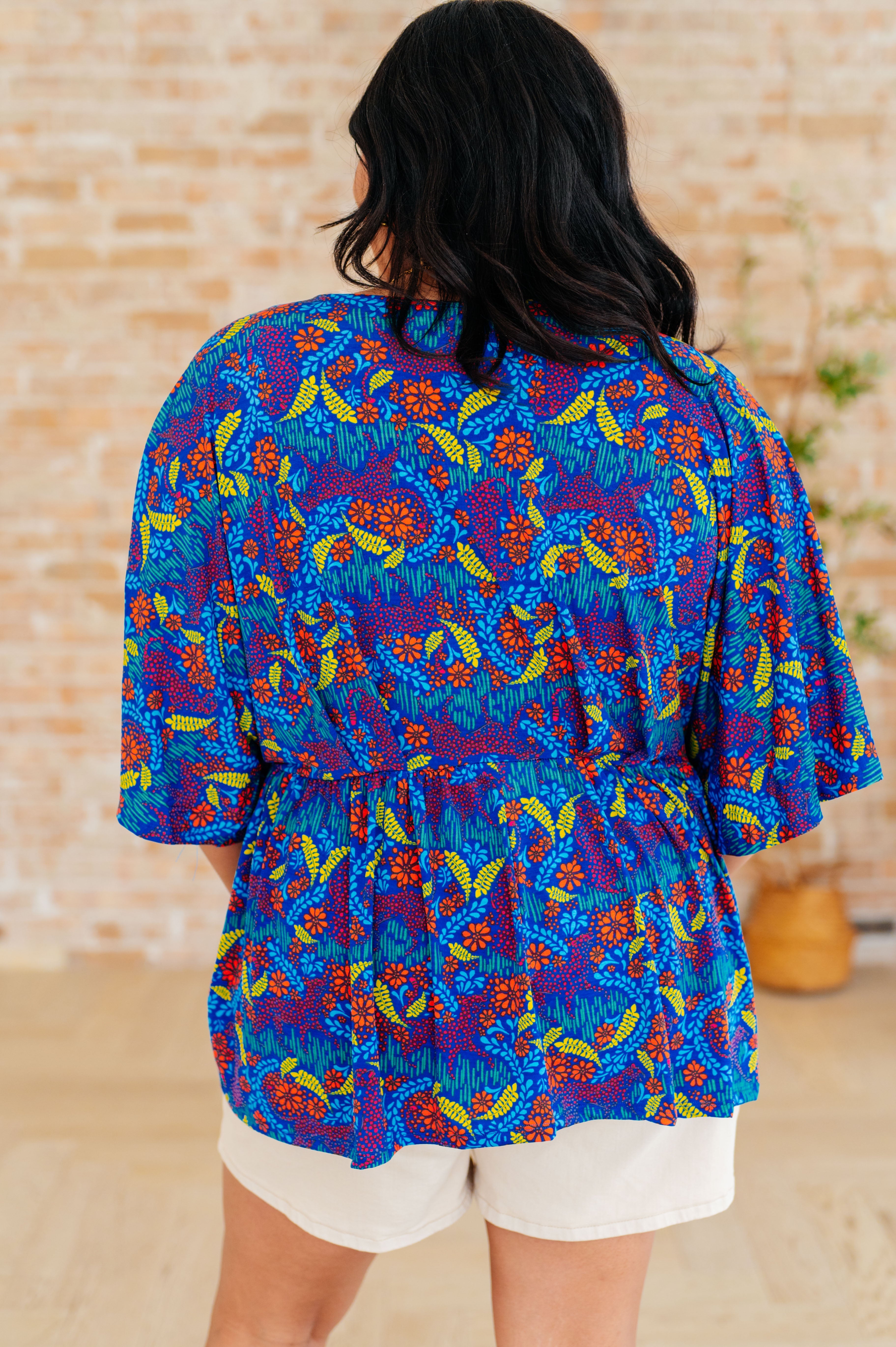 Dreamer Peplum Top in Royal and Red Abstract - Charming Charlie