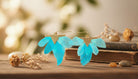 Blue Sky Feather Earrings - Charming Charlie