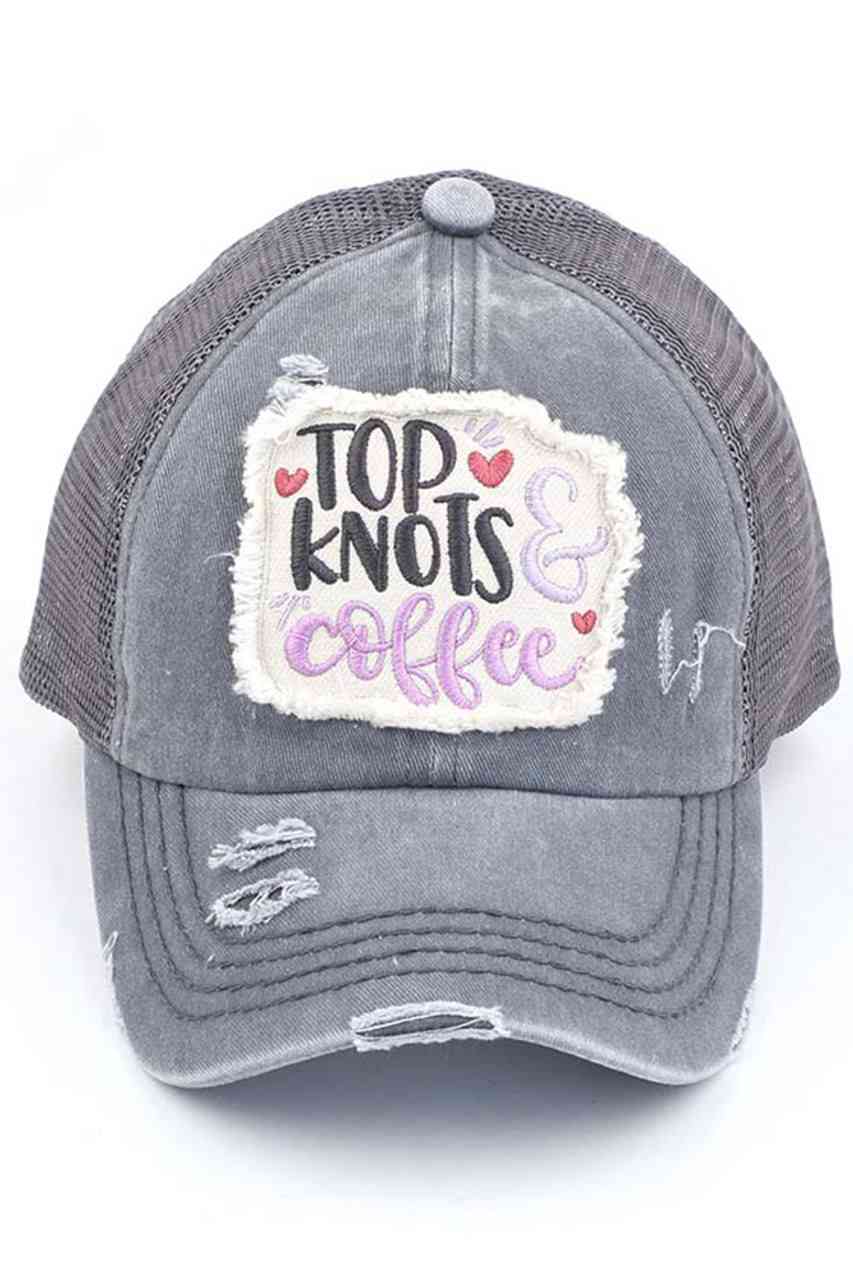 GRAY-C.C DISTRESSED TOP KNOTS AND COFFEE PATCH PONYCAP is an essential accessory for coffee lovers. Made with distressed fabric and a stylish top knot, it also features an embroidered coffee patch. Stay fashionable while showing off your love for coffee.