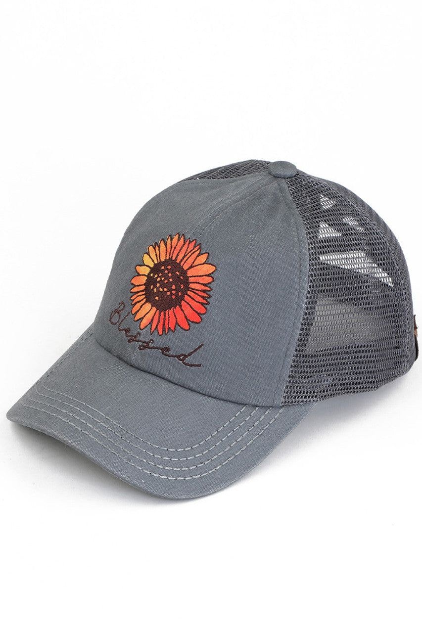 Gray  C.C DAISY PATCH BLESSED PONY CAP is the perfect accessory for any ponytail! With the bonus of a daisy patch, this cap not only keeps you in style but also adds a touch of femininity to your look. Keep your hair out of your face and elevate your outfit with this cap.