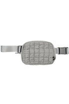 Gray C.C Quilted Puffer Fanny Pack is a stylish and functional accessory for any on-the-go individual. Made with durable quilted material, this fanny pack provides convenient storage for your essentials while remaining comfortable to wear. Perfect for travelers, runners, and outdoor enthusiasts.