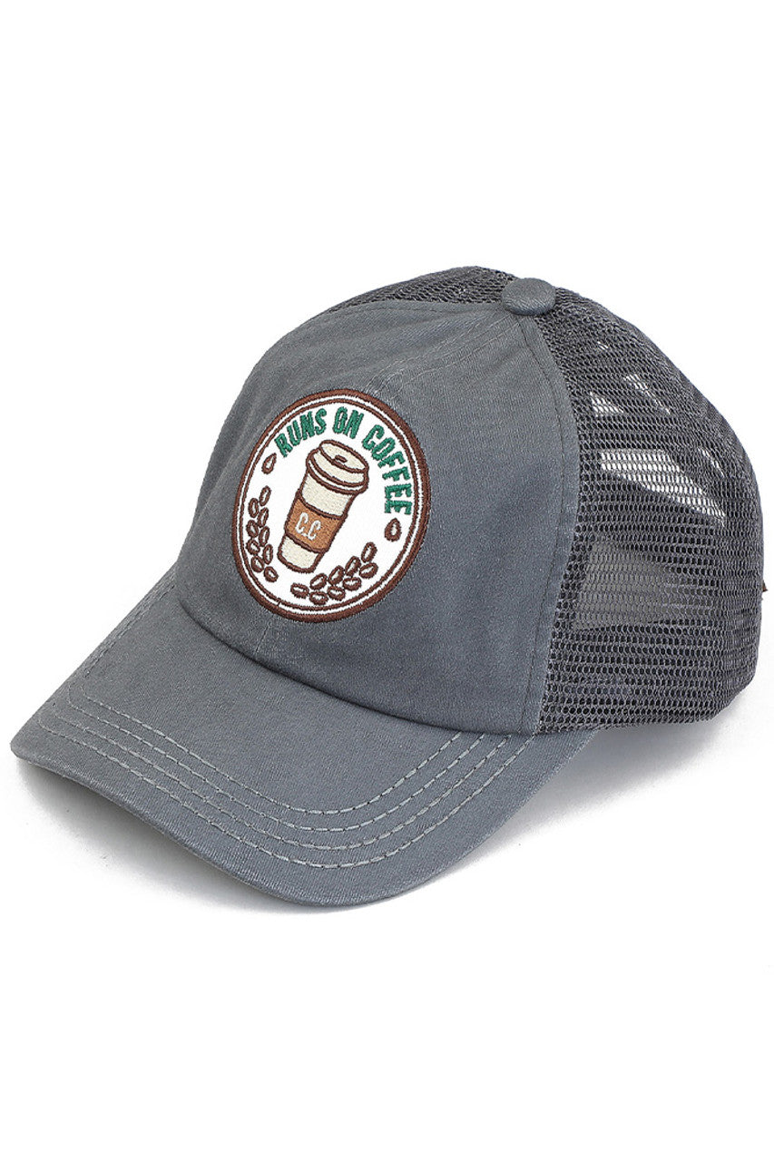 Gray C.C RUNS ON COFFEE PATCH CRISS CROSS PONY CAP combines fashion with function, featuring a unique criss-cross design and a playful "Runs on Coffee" patch. Made with high-quality materials, this cap is perfect for those who want to show off their love for coffee while staying stylish and comfortable.