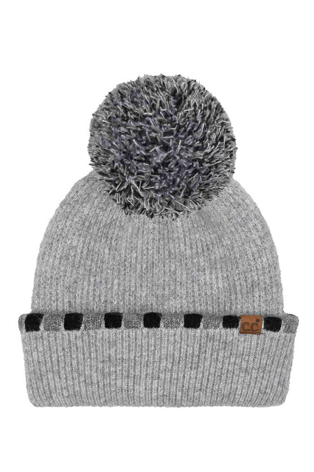 Gray Wrap yourself in cozy chic with the C.C Neutral Horizontal Stripe Pom Beanie. Its stylish cuffed design and charming pom detail add a playful touch to any outfit. Perfect for brisk days out or cozy nights in, this beanie is a must-have accessory for the modern woman on the go. Elevate your winter wardrobe or gift it to a fashion-forward friend. Stay warm, stay fabulous!