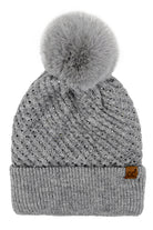 GrayC.C Allover Rhinestone Pom Beanie combines expert craftsmanship with stylish practicality. Crafted from soft, warm knit material, this beanie is adorned with shimmering rhinestones for an elegant yet understated sparkle. The plush pom on top adds a classic touch while ensuring cozy protection against cold weather. Perfect for elevating your winter wardrobe, it offers a refined blend of comfort, durability, and sophistication. 