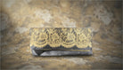 Black Clutch Adorned with Intricate Gold Lace - Charming Charlie