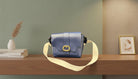 Blue Leather Crossbody Bag with a Gold Buckle and Cream Strap - Charming Charlie
