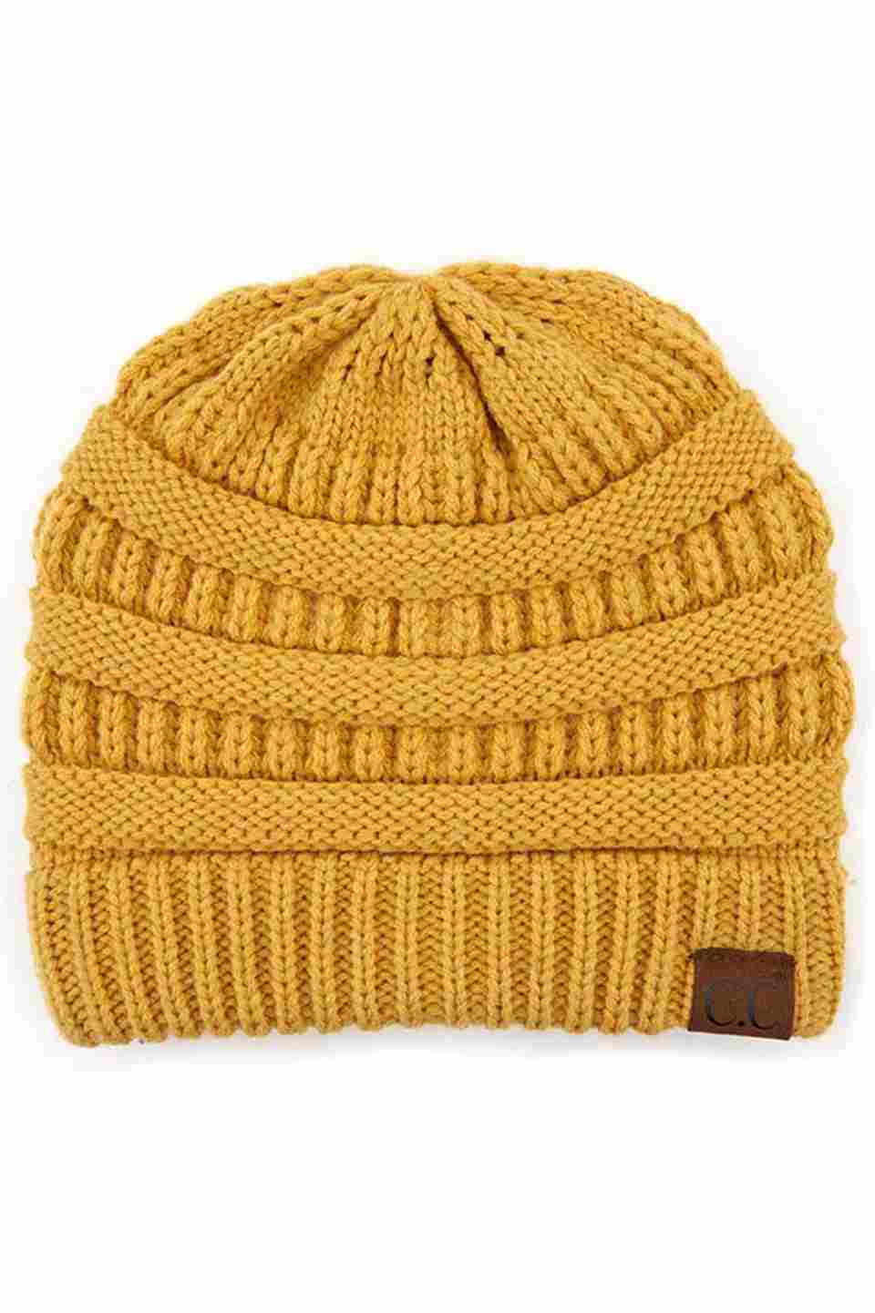 HoneyMustard C.C Ribbed Knit Solid Color Beanie offers a timeless design with durable ribbed knitting, ensuring a snug and comfortable fit. Crafted for warmth and versatility, this beanie is perfect for everyday wear, providing reliable protection against cold weather while maintaining a sleek, minimalist style that complements any outfit. Its solid color adds understated appeal, making it an essential accessory for both casual and outdoor use.  