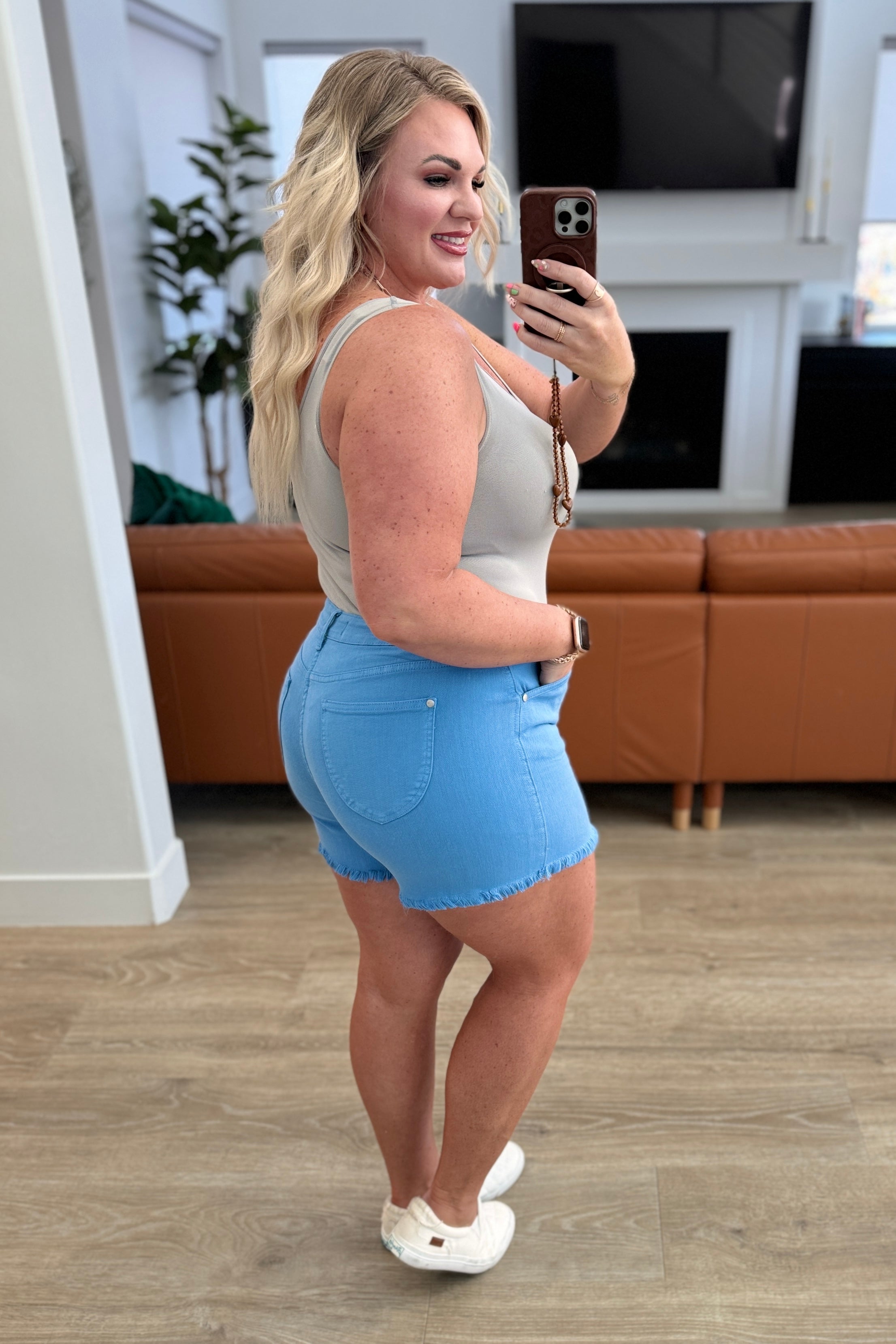 Celeste Mid Rise Shield Pocket Cutoff Shorts in Sky Blue - Charming Charlie
