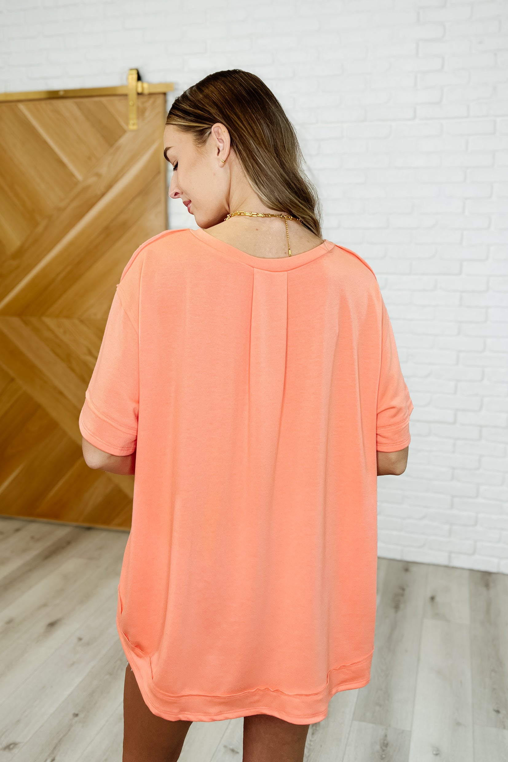 In the Rotation Exposed Seam Tee in Apricot Splash - Charming Charlie