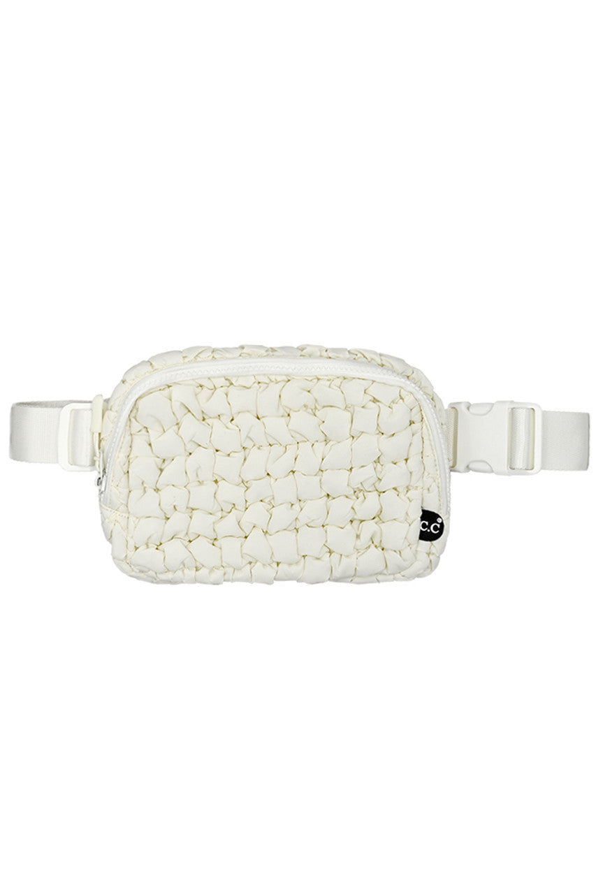 Ivory C.C Quilted Puffer Fanny Pack is a stylish and functional accessory for any on-the-go individual. Made with durable quilted material, this fanny pack provides convenient storage for your essentials while remaining comfortable to wear. Perfect for travelers, runners, and outdoor enthusiasts.