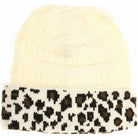 Ivory Matching Cuff Leopard Print CC Beanie combines expert craftsmanship with standout style. Designed with a comfortable cuff and eye-catching leopard pattern, this beanie offers reliable warmth and a fashionable look. Its stretchy fabric ensures a secure fit for extended wear, making it an ideal accessory for cool weather while enhancing your seasonal wardrobe with a touch of wild sophistication. 