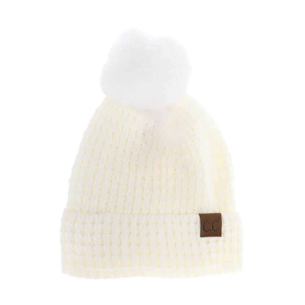 Ivory C.C Waffle Knit Pattern Cuff Pom Pom Beanie Hat, Stay warm in style with this. Made from a warm and cozy waffle knit pattern with a fashionable cuff and a pom pom on top, this beanie hat is sure to keep you warm in any weather and make you stand out in the crowd. Perfect winter gift idea. 