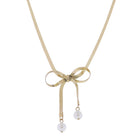 Gold Snake Chain Necklace with Gold Bow with Pearl Ends - Charming Charlie