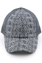 Light gray C.C FLOWER EMBROIDERY EYELET CRISS CROSS PONYCAP features delicate flower embroidery and eyelet detailing, with a criss cross design for a chic and stylish look. Made with quality materials, this cap offers both fashion and functionality. Perfect for any casual or outdoor activity, it will keep you cool and covered.