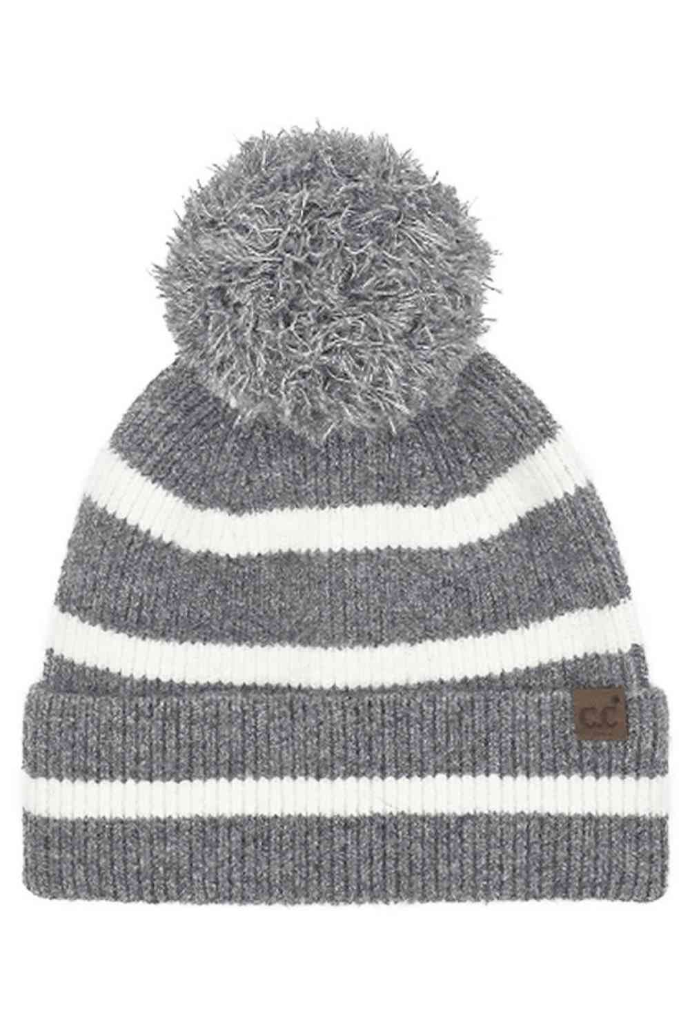 Light_gray Wrap yourself in cozy chic with the C.C Two Tone Stripe Yarn Pom Beanie. Its vibrant stripes and playful pom-pom effortlessly elevate any winter outfit. Crafted for both warmth and style, this beanie is the perfect accessory for your daily adventures or a thoughtful gift for a fashion-forward friend. Embrace the season in style – get yours today!