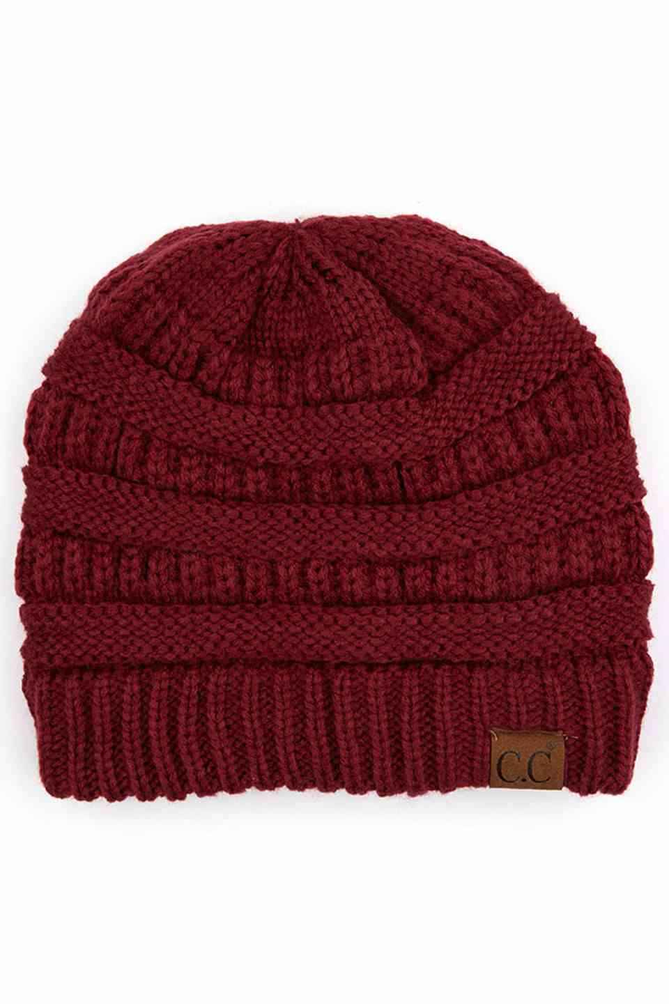Maroon  C.C Ribbed Knit Solid Color Beanie offers a timeless design with durable ribbed knitting, ensuring a snug and comfortable fit. Crafted for warmth and versatility, this beanie is perfect for everyday wear, providing reliable protection against cold weather while maintaining a sleek, minimalist style that complements any outfit. Its solid color adds understated appeal, making it an essential accessory for both casual and outdoor use. 