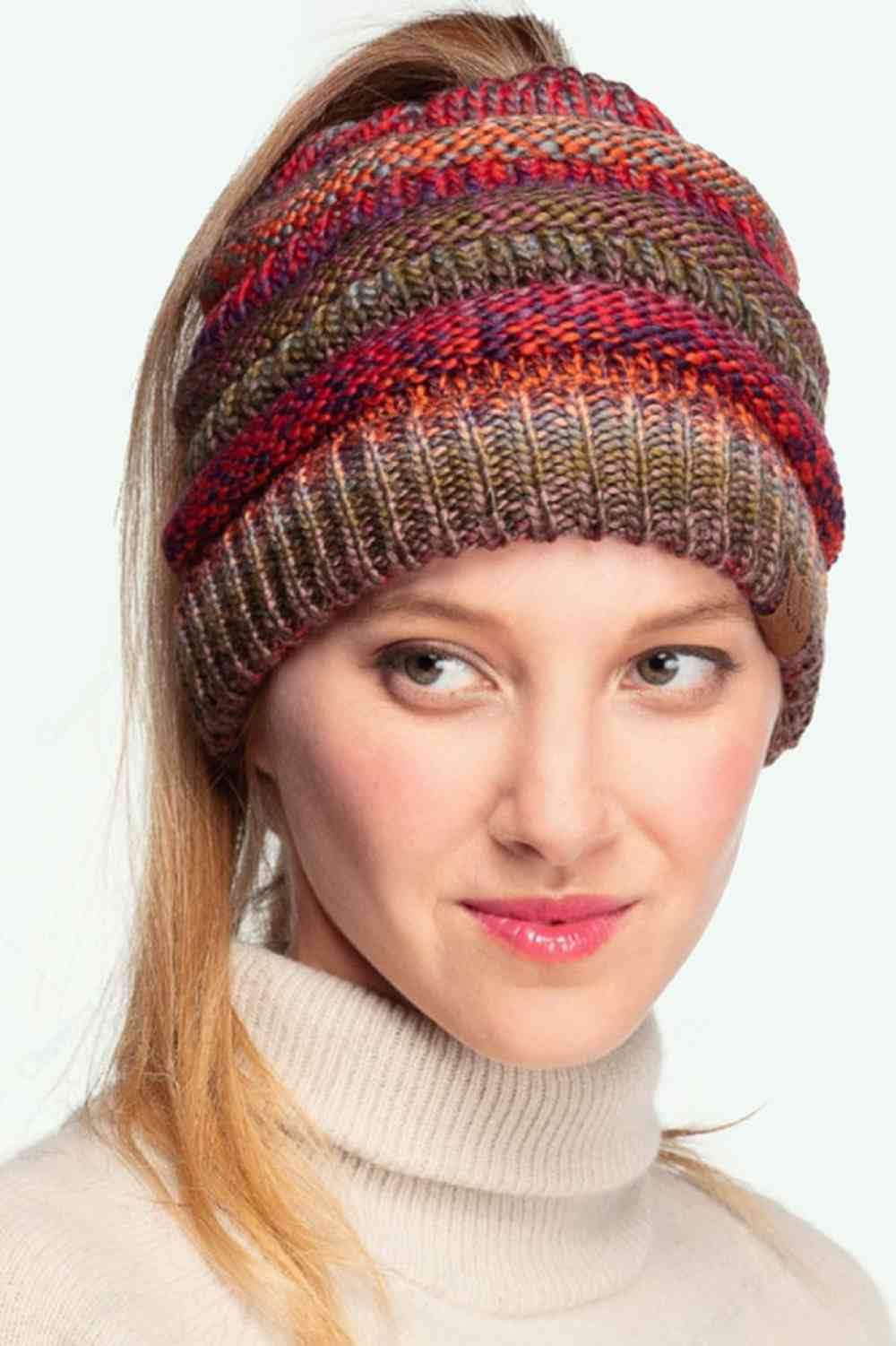 Multi color Wrap yourself in cozy chic with our Multi Color Cable Knit Beanie. This vibrant accessory adds a pop of personality to any outfit, featuring a playful mix of hues and a snug, comfortable fit. Perfect for brisk strolls, coffee dates, or gifting to your stylish friends. Elevate your look and stay warm in style!