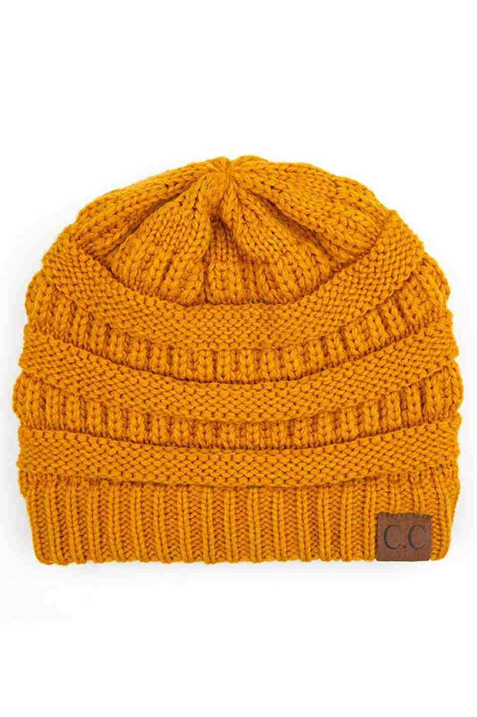 Mustard  C.C Ribbed Knit Solid Color Beanie offers a timeless design with durable ribbed knitting, ensuring a snug and comfortable fit. Crafted for warmth and versatility, this beanie is perfect for everyday wear, providing reliable protection against cold weather while maintaining a sleek, minimalist style that complements any outfit. Its solid color adds understated appeal, making it an essential accessory for both casual and outdoor use. 