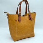 Mustard Vegan&nbsp;Leather Tote Shoulder Handbags For Women. Ideal for everyday occasions such as work, school, shopping, etc. Made of high quality&nbsp;Vegan&nbsp; leather material that's light weight and comfortable to carry. Spacious main compartment with magnetic snap closure to safely store a variety of personal items such as wallet, tablet, phone, books, and other essentials. One interior open pocket for small accessories within hand's reach.